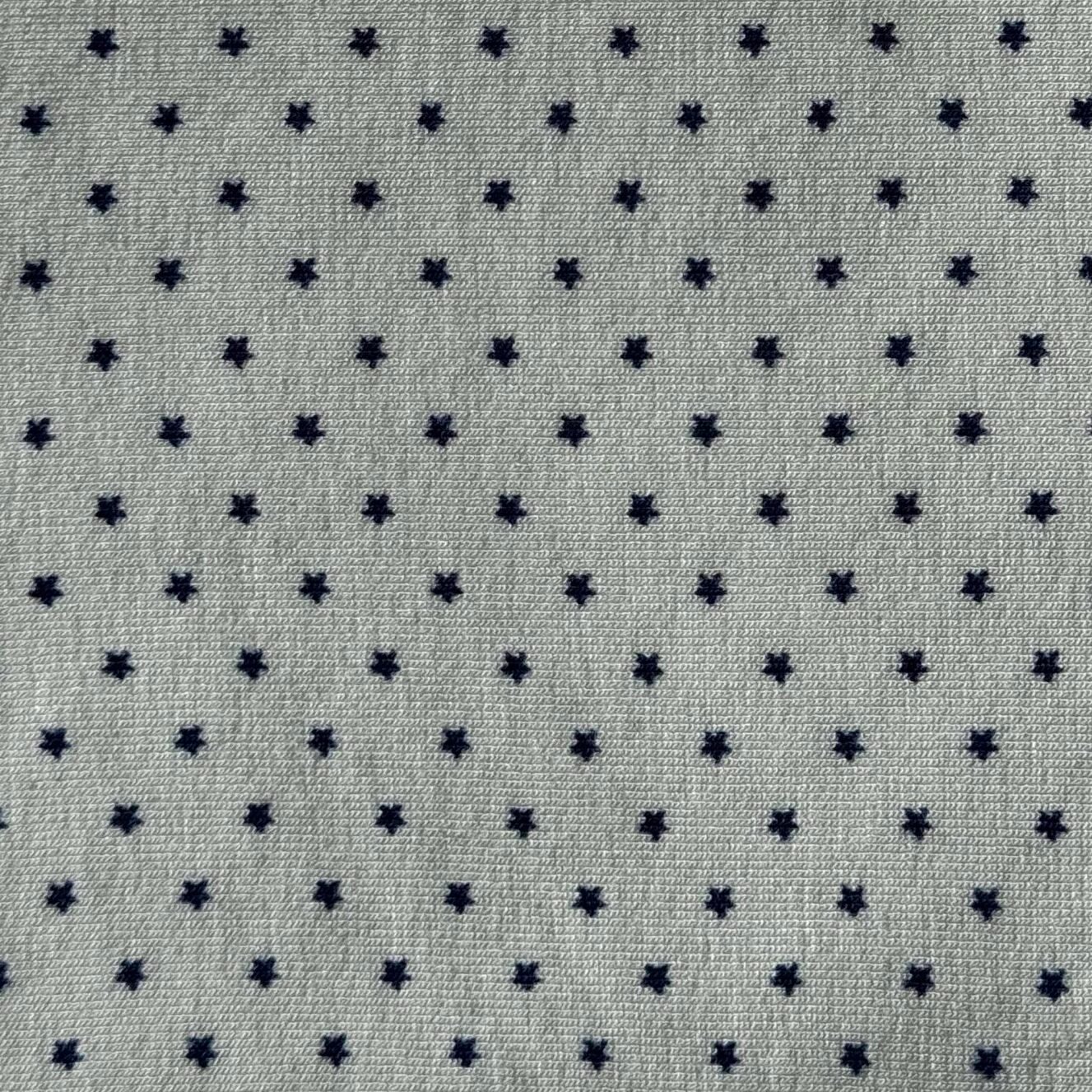 Tamsiai mėlynos žvaigždutės žalsvame fone